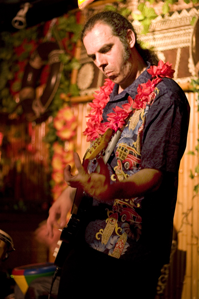 The Colonel playing the Rock-a-Hula Xmas Party
